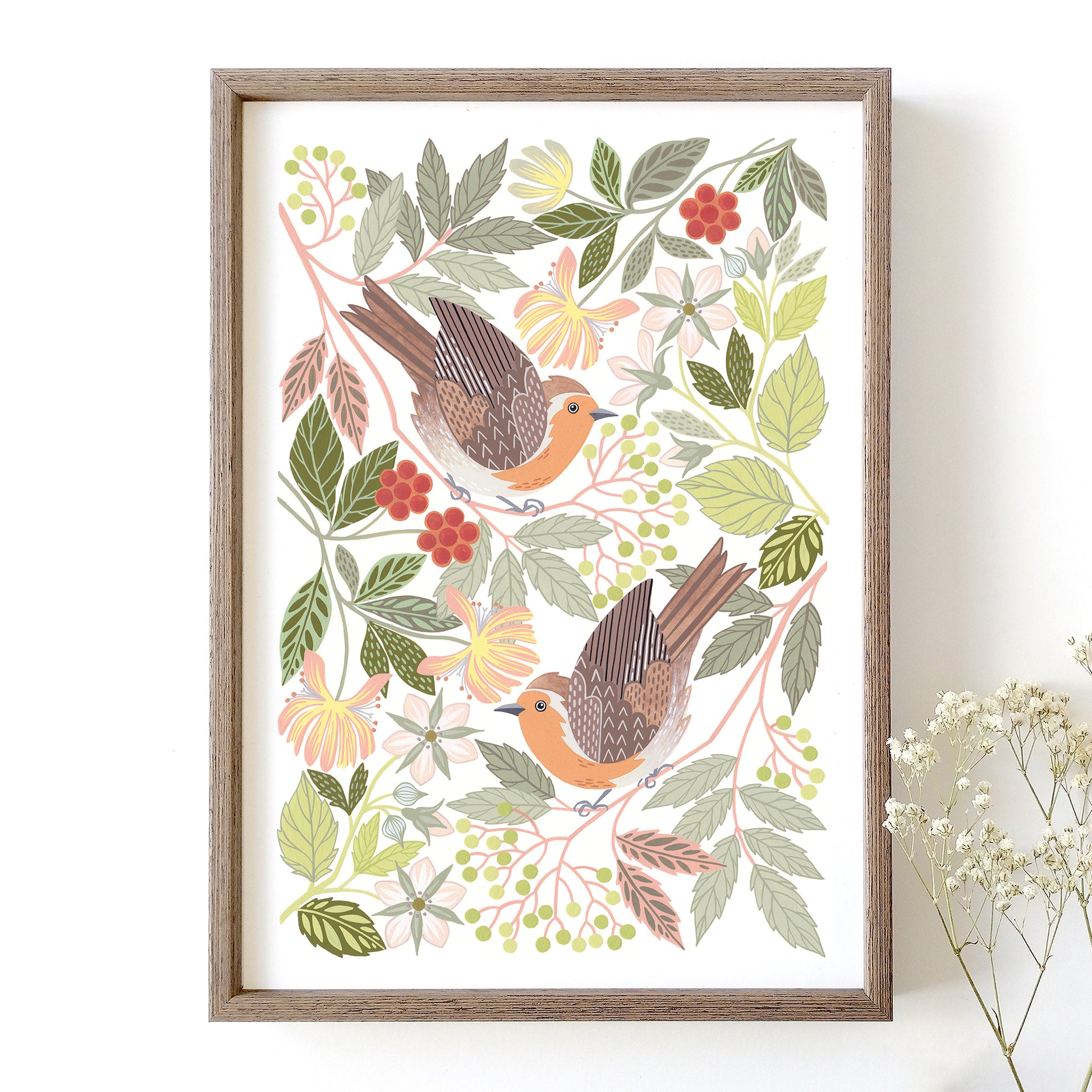 Framed robin artwork with woodland foliage on a white background